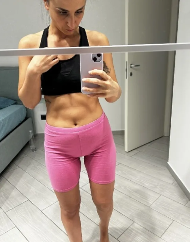 Federica showing reduced bloating after one month of Pilates